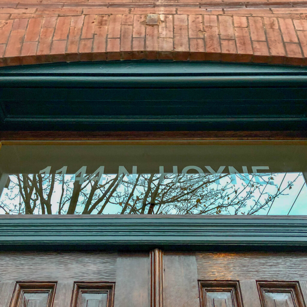 New sandblasted address transom glass in restored window