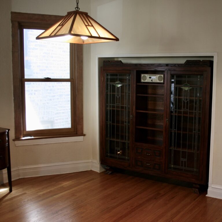 Cabinet set into a recessed nook - designed to house the client's sound system